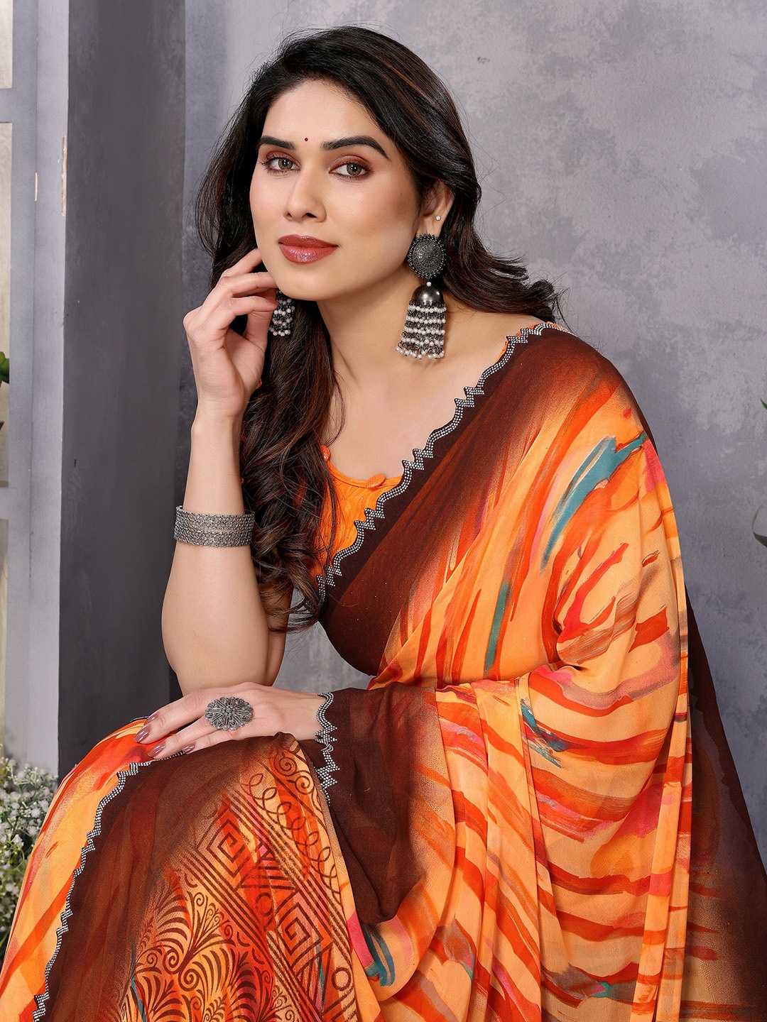 

Nirmohi Fashion Beads and Stones Pure Georgette Saree, Orange