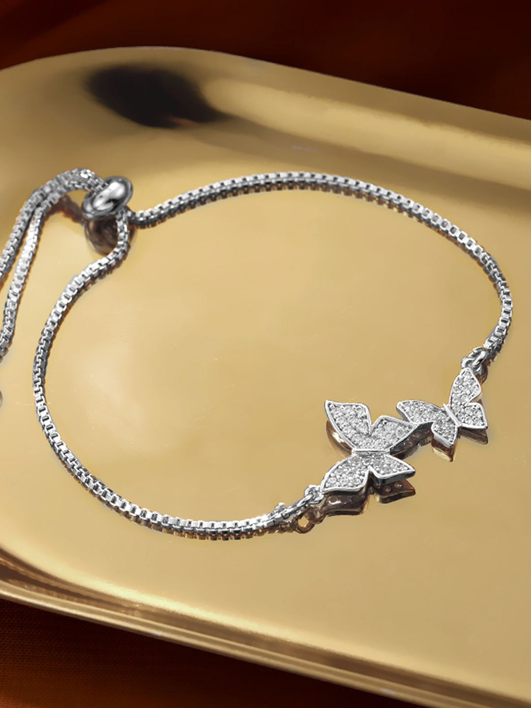 

Peora Silver-Plated Cubic Zirconia Studded Butterfly Style Adjustable Wraparound Bracelet