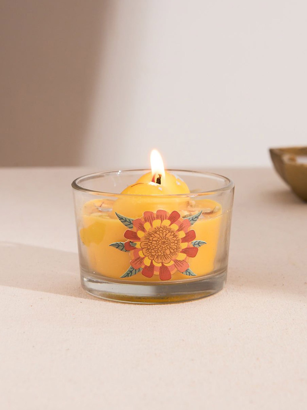 

Chumbak Yellow & Transparent Floral Printed Festive Warmth Candle