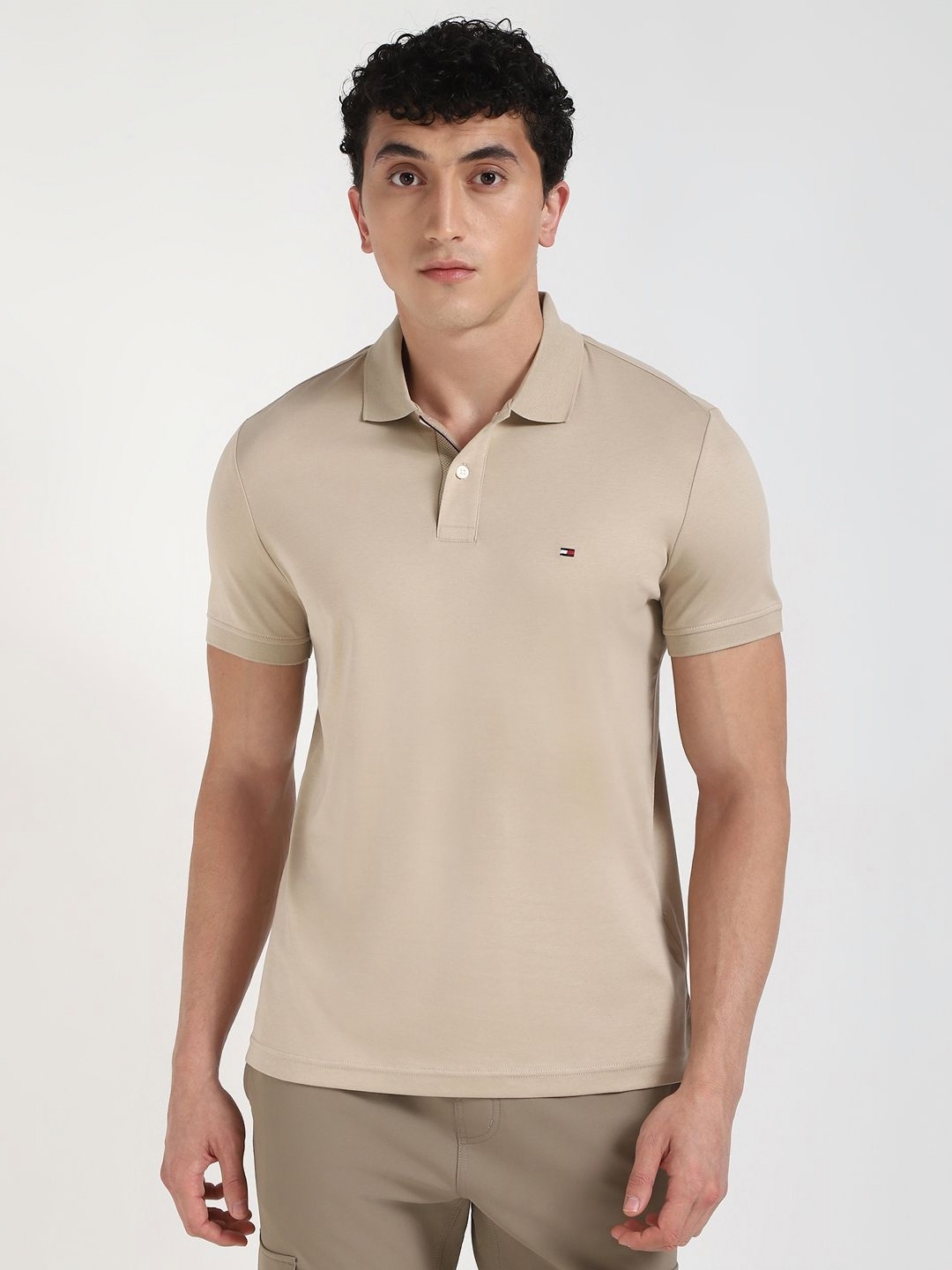 

Tommy Hilfiger Men Solid Polo Collar Cotton T-shirt, Beige