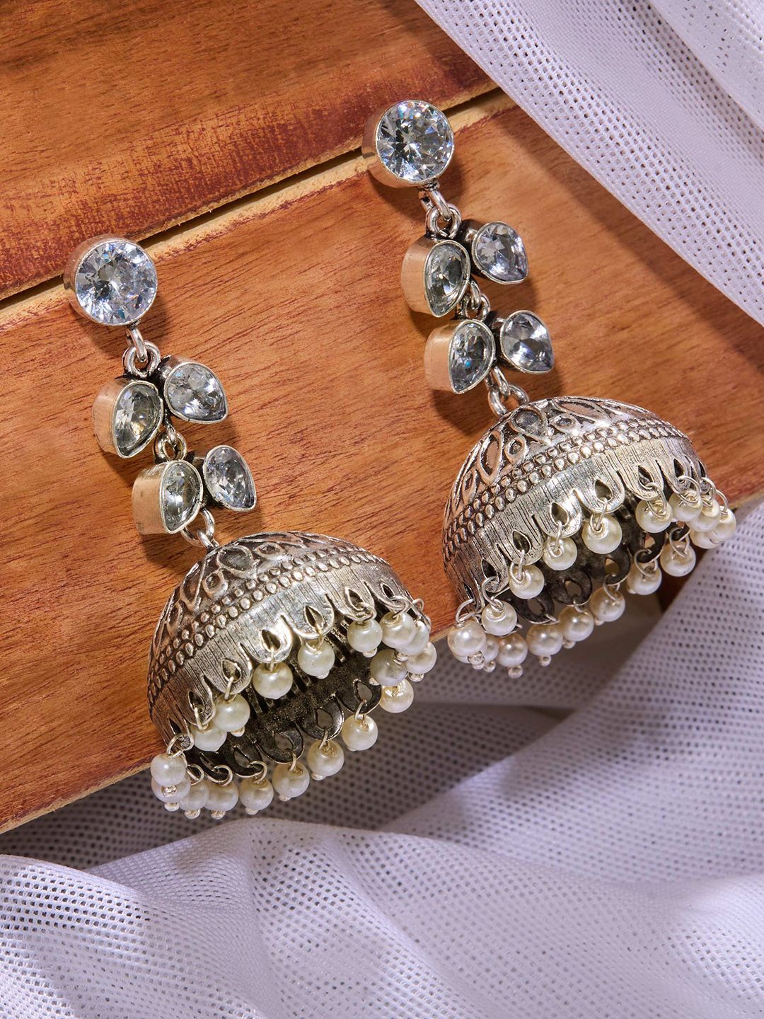 

Priyaasi Silver Plated Crystals Dome Shaped Oxidized Jhumkas Earrings