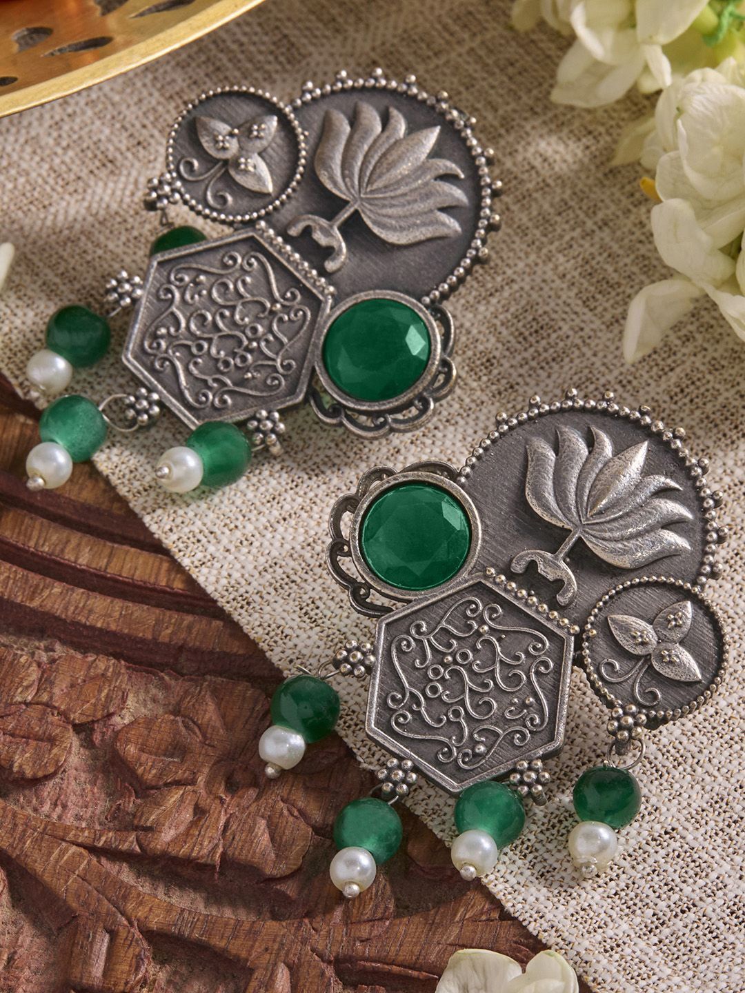 

Priyaasi Silver Plated Emerald Stone Studded & Beaded Oxidized Lotus Desgin Drop Earrings, Green