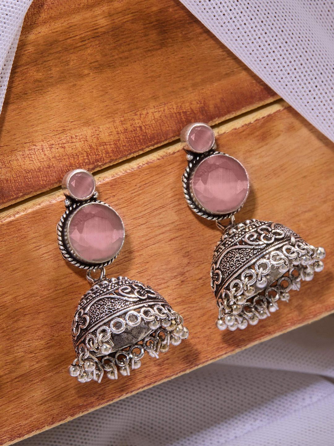 

Priyaasi Silver Plated Crystals Dome Shaped Oxidized Jhumkas Earrings