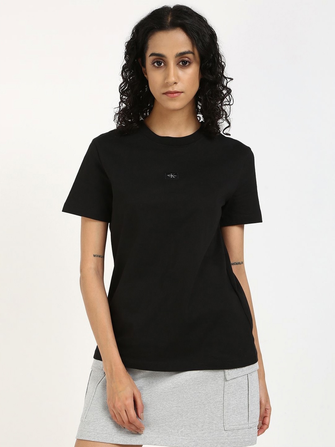 

Calvin Klein Jeans Women Solid Round Neck Cotton T-shirt, Black
