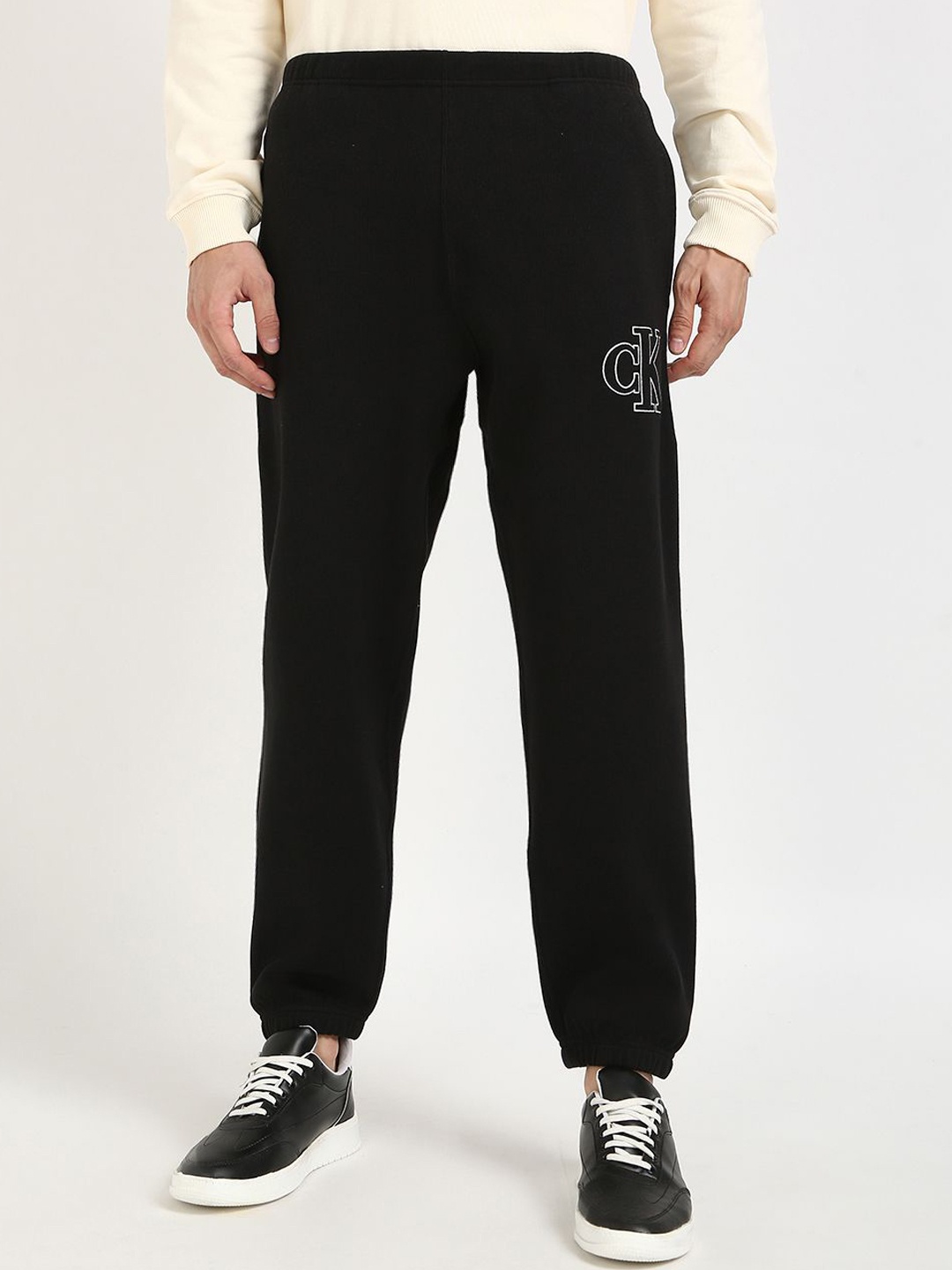 

Calvin Klein Jeans Men Logo Printed Regular Fit Joggers, Black