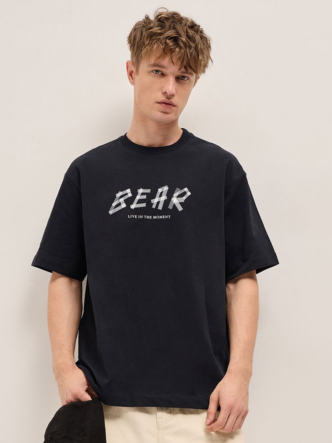 

THE BEAR HOUSE Men Typography Printed Round Neck Cotton Oversized T-shirt, Black