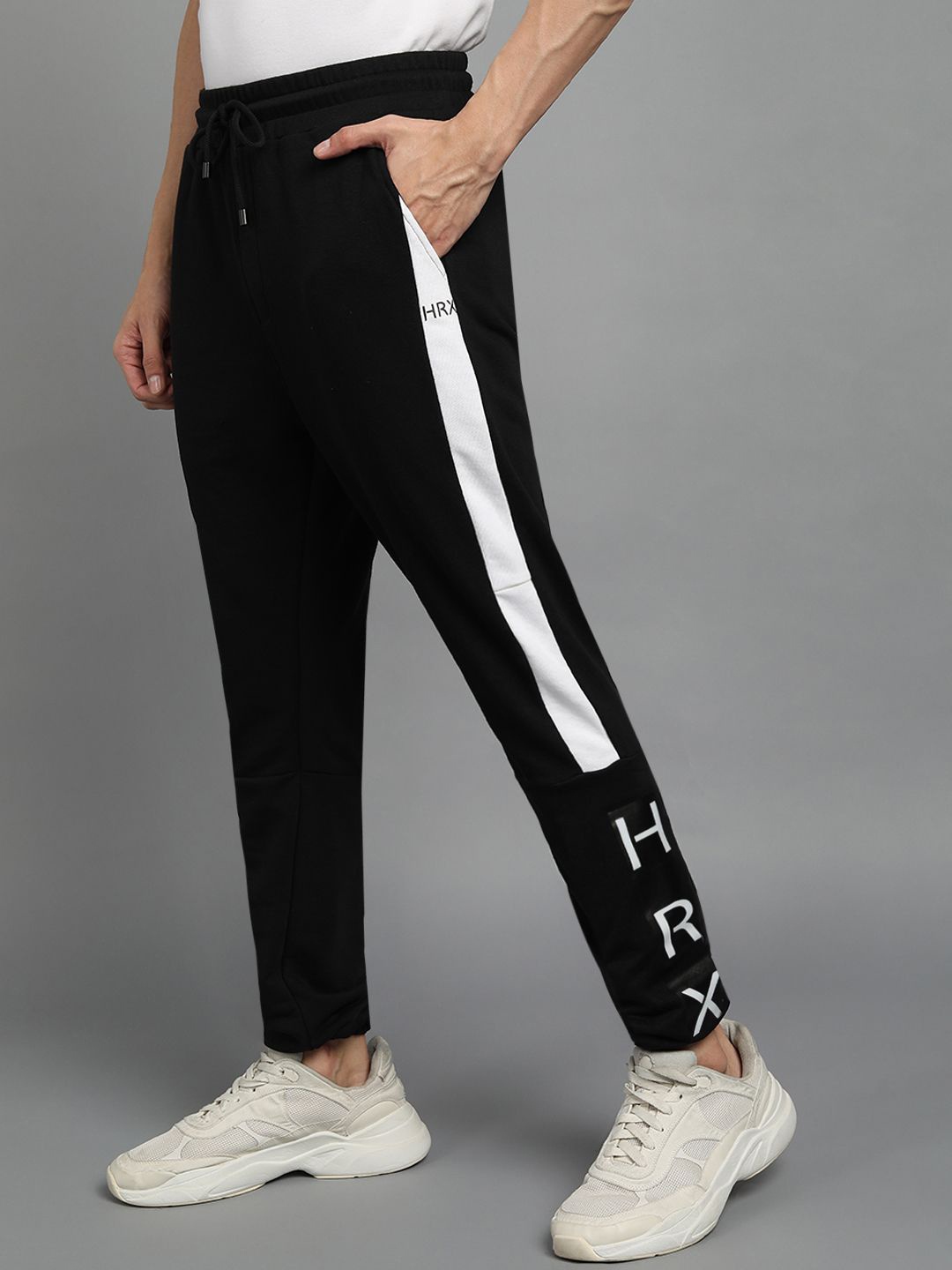 

HRX by Hrithik Roshan Men Relaxed Fit Mid Rise Track Pants, Black