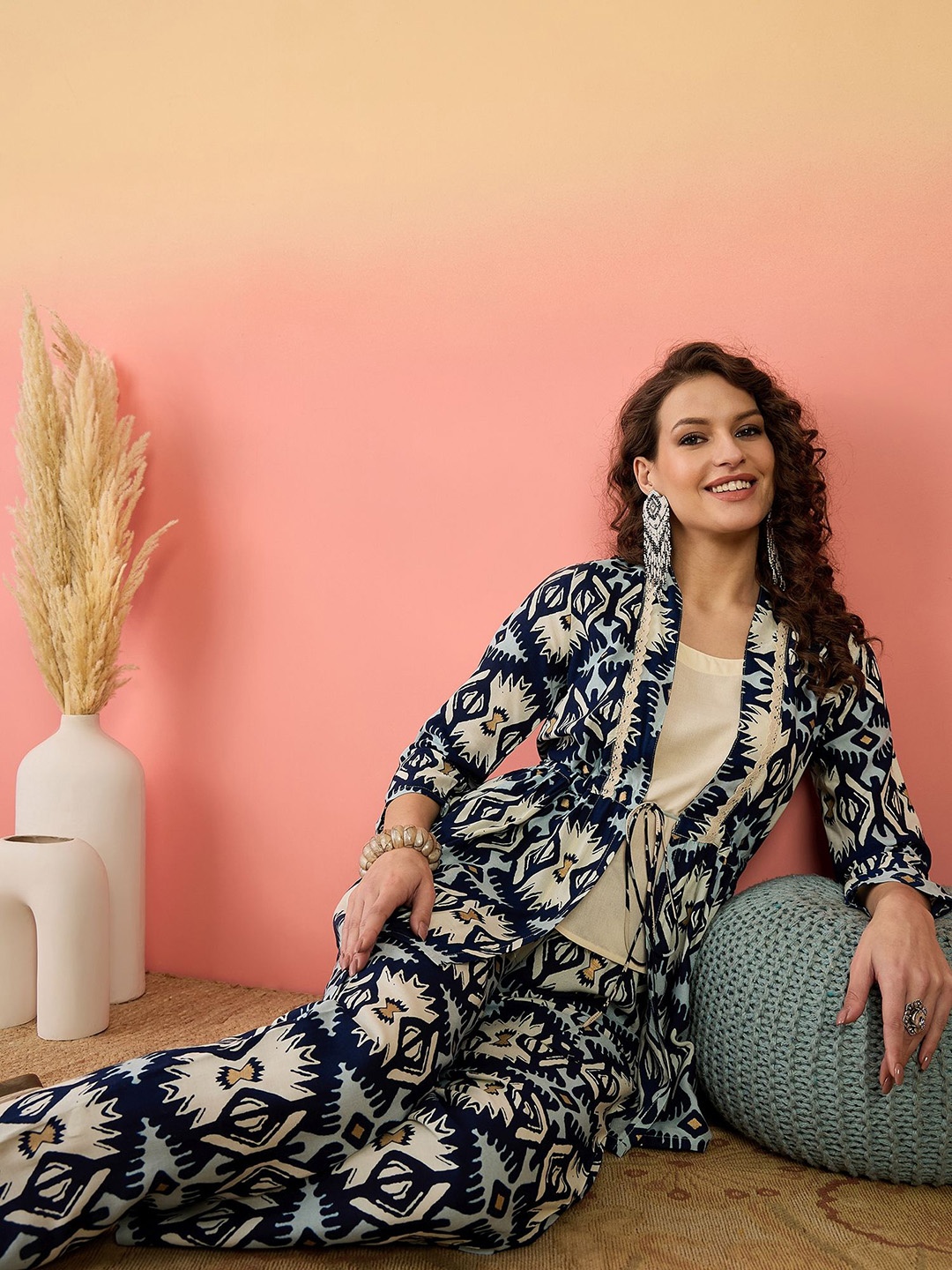 

Sangria Blue Ikat Printed Shawl Neck Open Shirt And Trousers, Navy blue