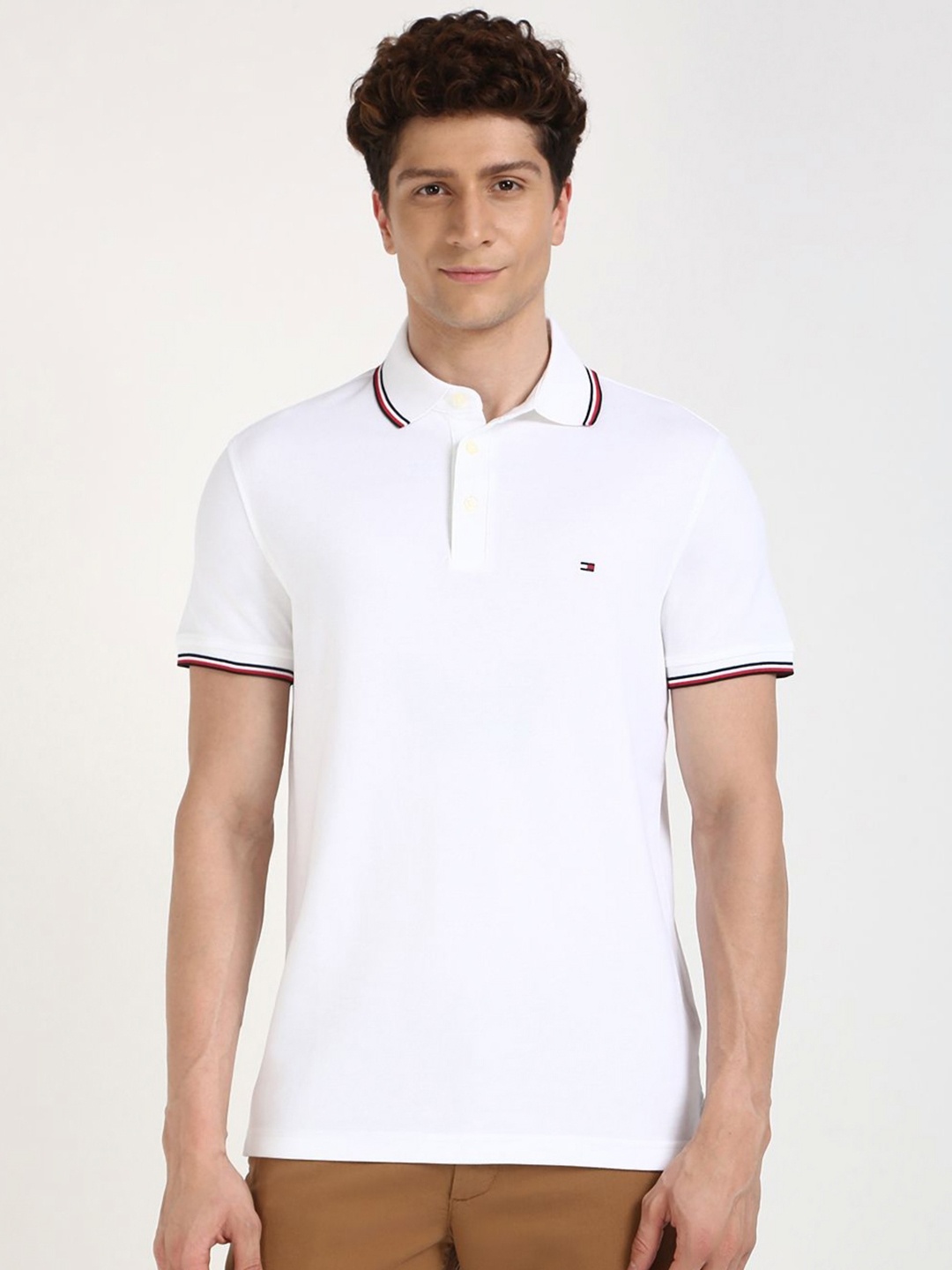 

Tommy Hilfiger Men Solid Polo Collar Cotton T-shirt, White