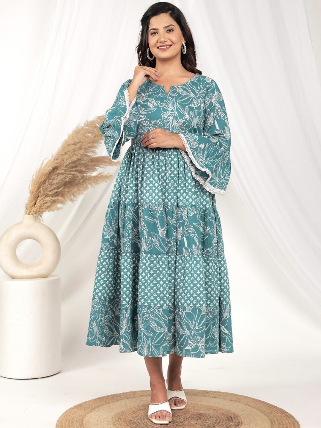 

Aramya Floral Printed Notch-Neck Flared Sleeves Pure Cotton Fit And Flare Dress, Turquoise blue