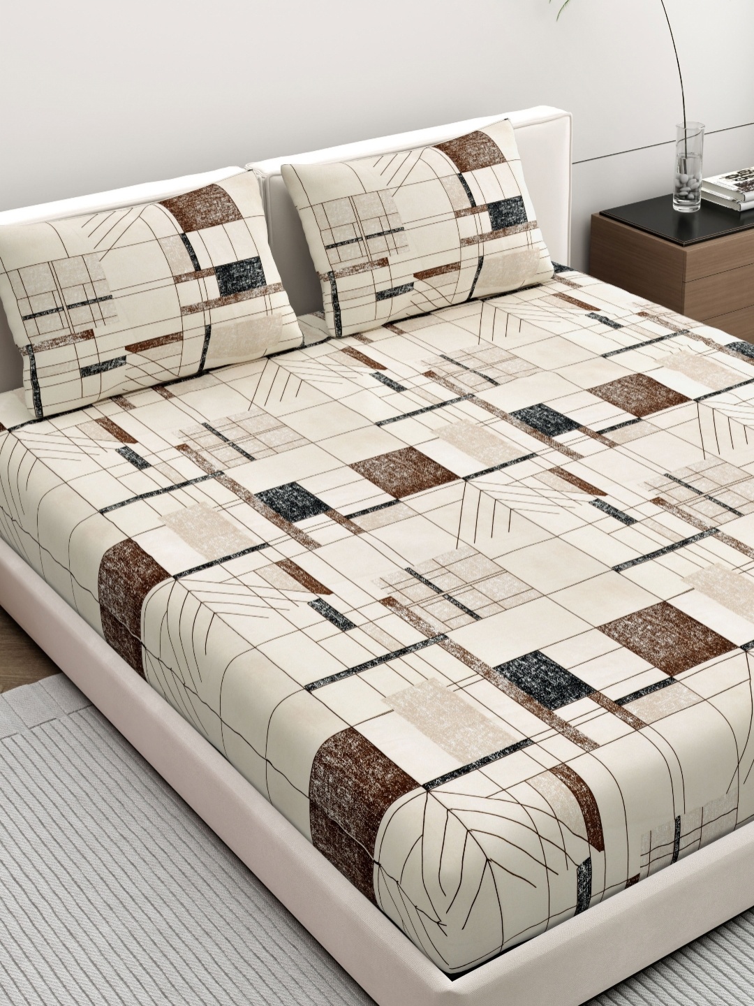 

DREAM WEAVERZ Beige & Black Geometric Printed 140 TC Queen Bedsheet Set 2.23m x 2.39m