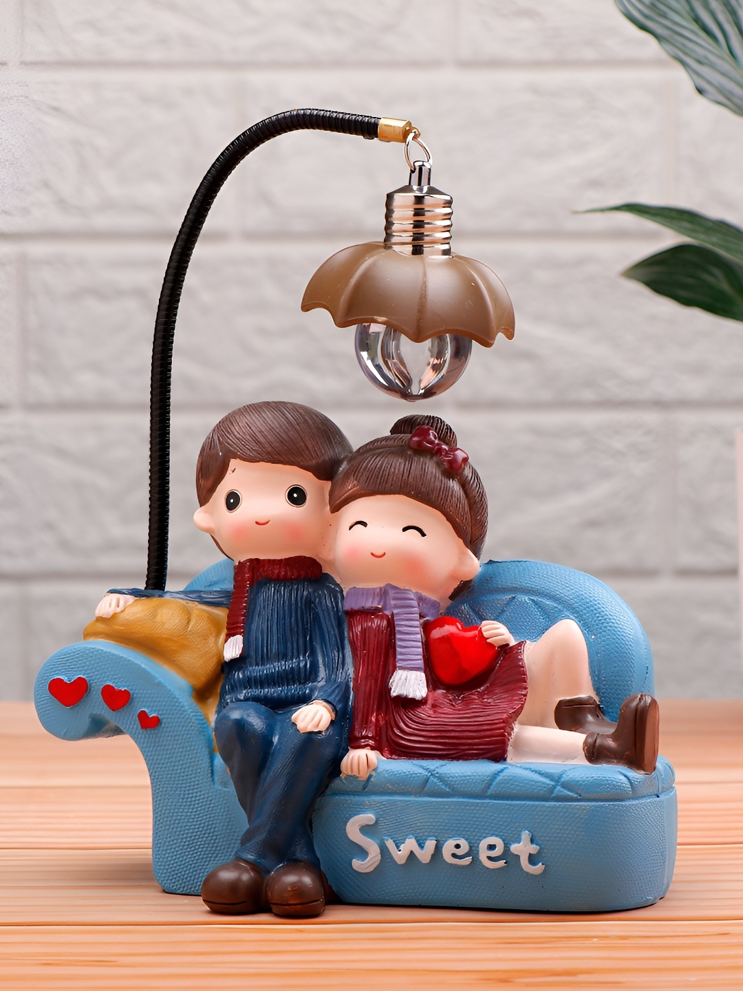 

Archies Blue & Red Sweet Couch Couple Illuminating Figurine Showpiece