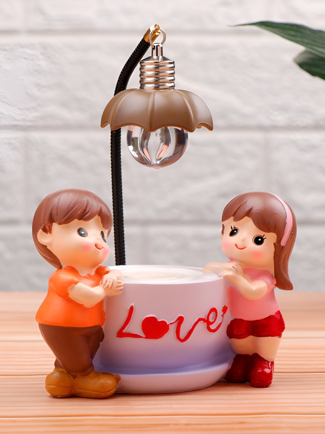 

Archies Orange Cup of Love Illuminating Figurine Showpiece