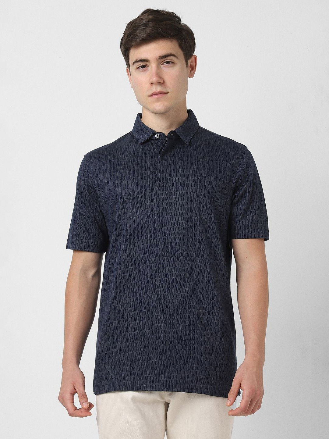 

Peter England Elite Men Self Design Polo Collar Cotton T-shirt, Navy blue