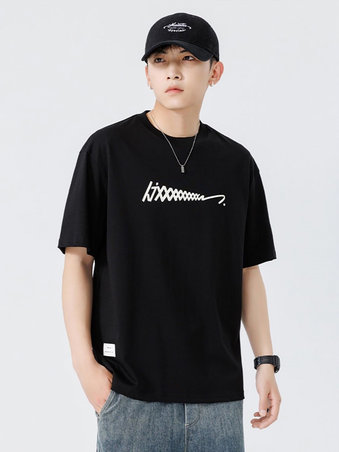 

StyleCast x Revolte Men Graphic Printed Round Neck Cotton Oversized T-shirt, Black
