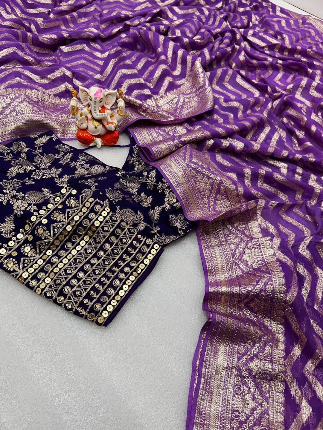 

PAYAL CREATION Striped Zari Pure Georgette Saree, Purple