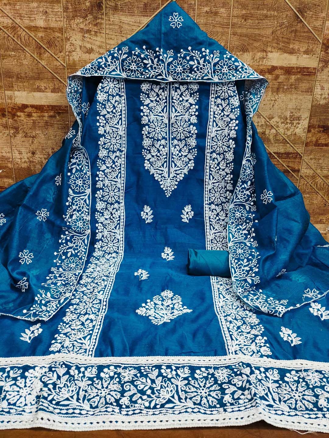 

Maroosh Floral Embroidered Thread Work Chanderi Cotton Unstitched Dress Material, Blue