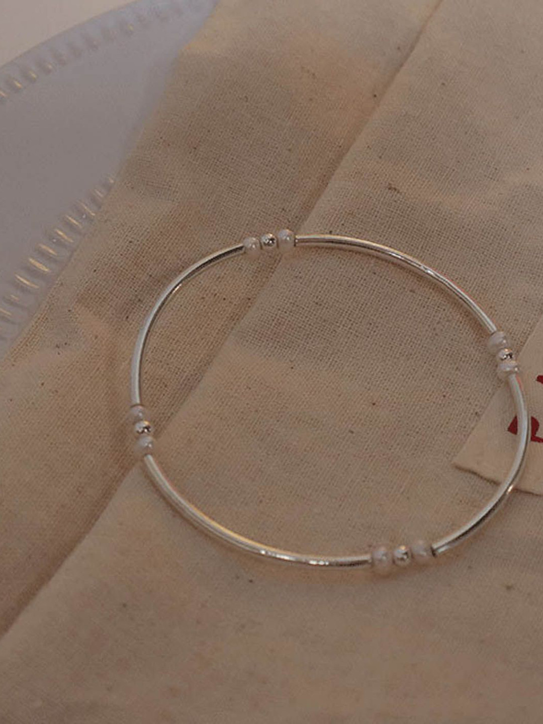 

StyleCast Women Brass Silver-Plated Bangle-Style Bracelet