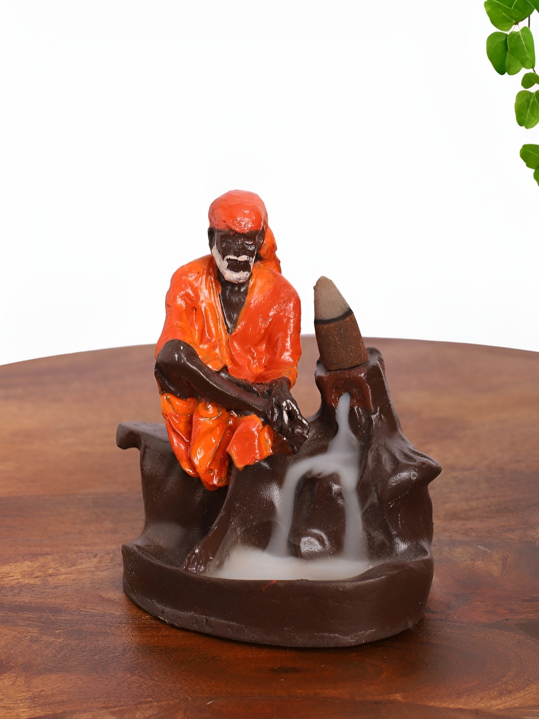 

INTERNATIONAL GIFT Orange Shai Baba Idol Backflow Religious Figurine Showpiece