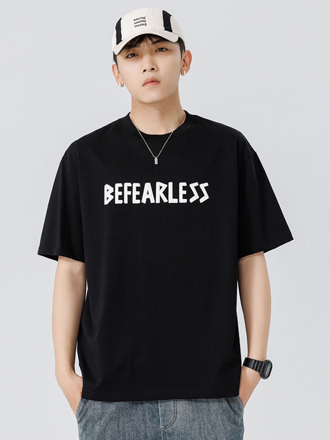 

StyleCast x Revolte Men Typography Printed Round Neck Cotton Oversized T-shirt, Black