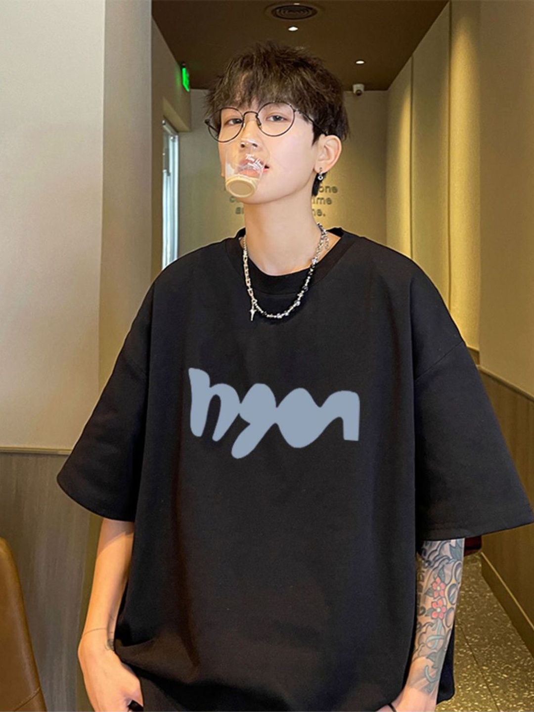 

StyleCast x Revolte Men Graphic Printed Round Neck Cotton Oversized T-shirt, Black