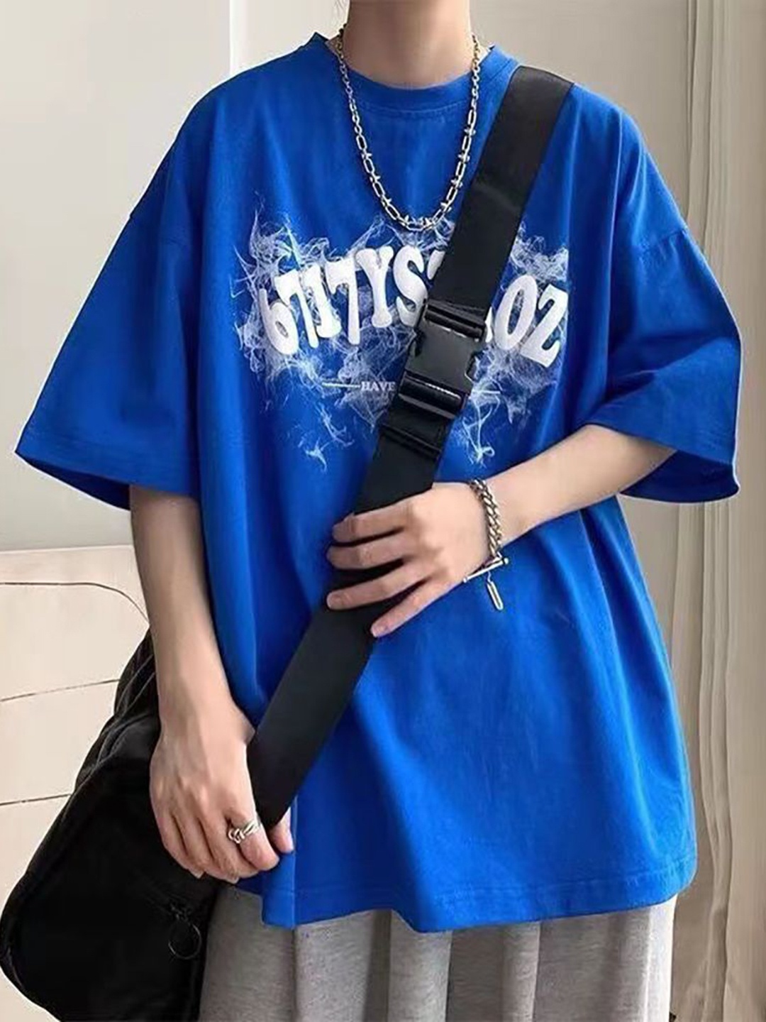 

StyleCast x Revolte Men Typography Printed Round Neck Cotton Oversized T-shirt, Blue