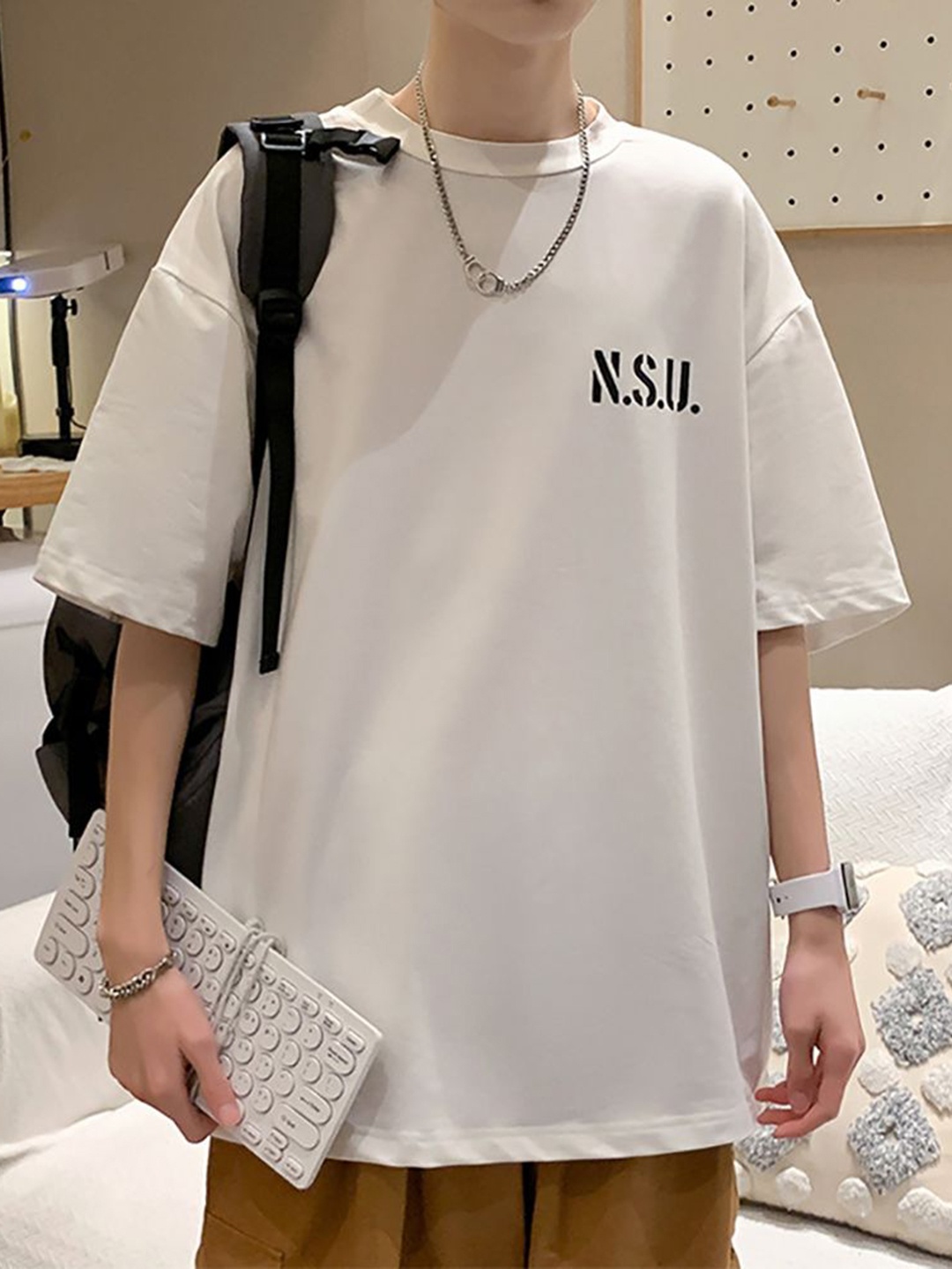 

StyleCast x Revolte Men Typography Printed Round Neck Oversized T-shirt, White