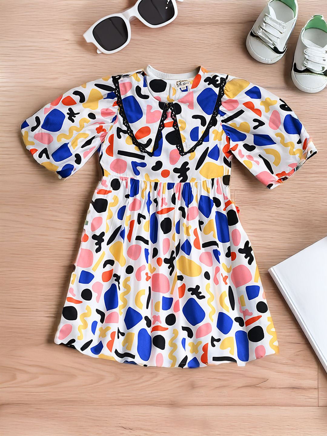 

Bella Moda Girls Abstract Printed Peter Pan Collar Puff Sleeves Fit and Flare Dress, White