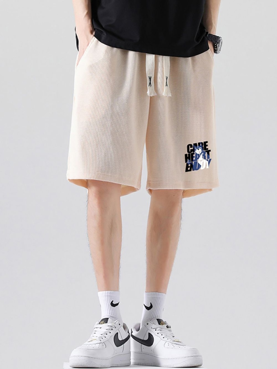 

StyleCast x Revolte Men Printed Mid-Rise Shorts, Beige