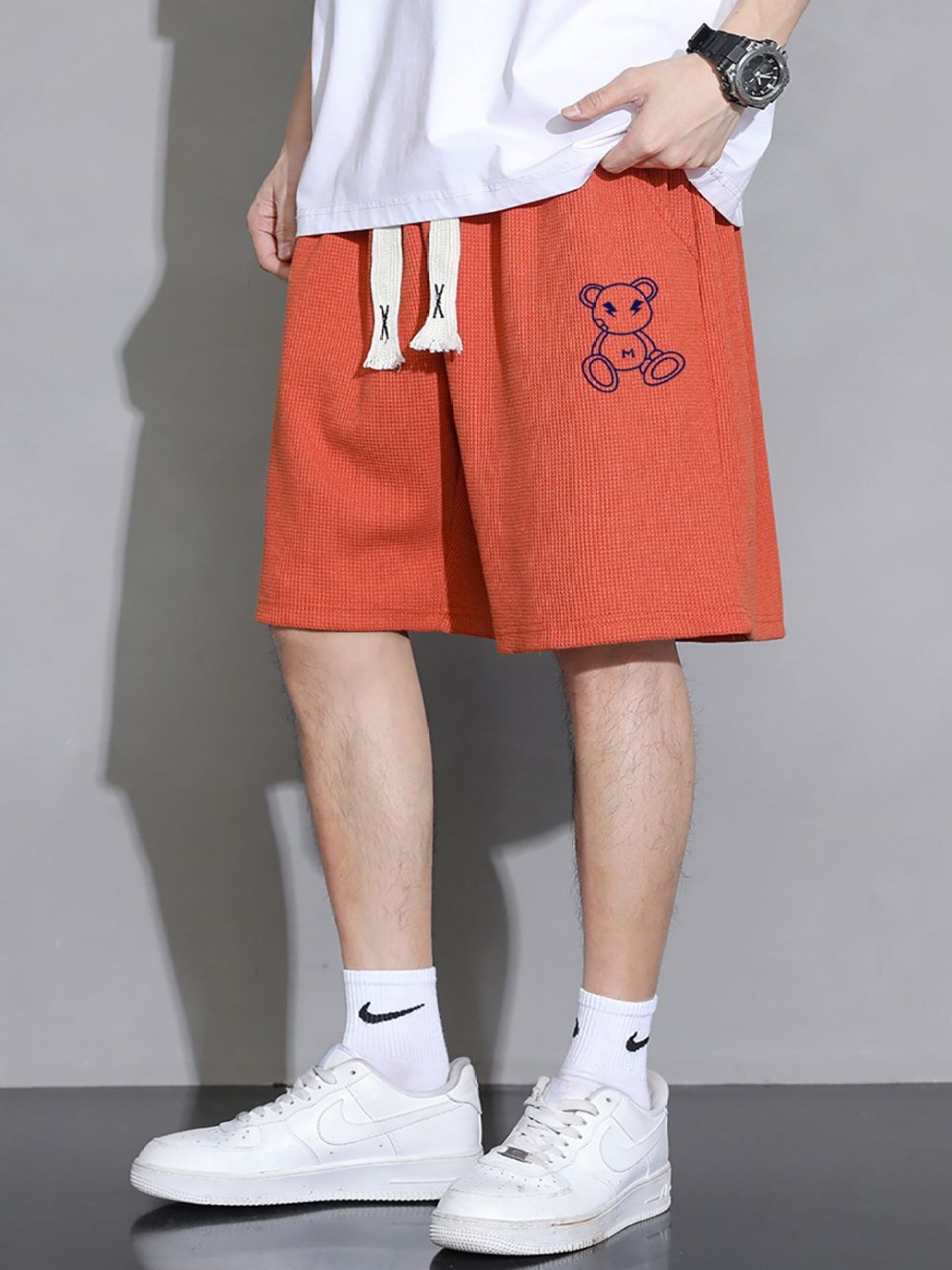 

StyleCast x Revolte Men Mid-Rise Printed Shorts, Orange
