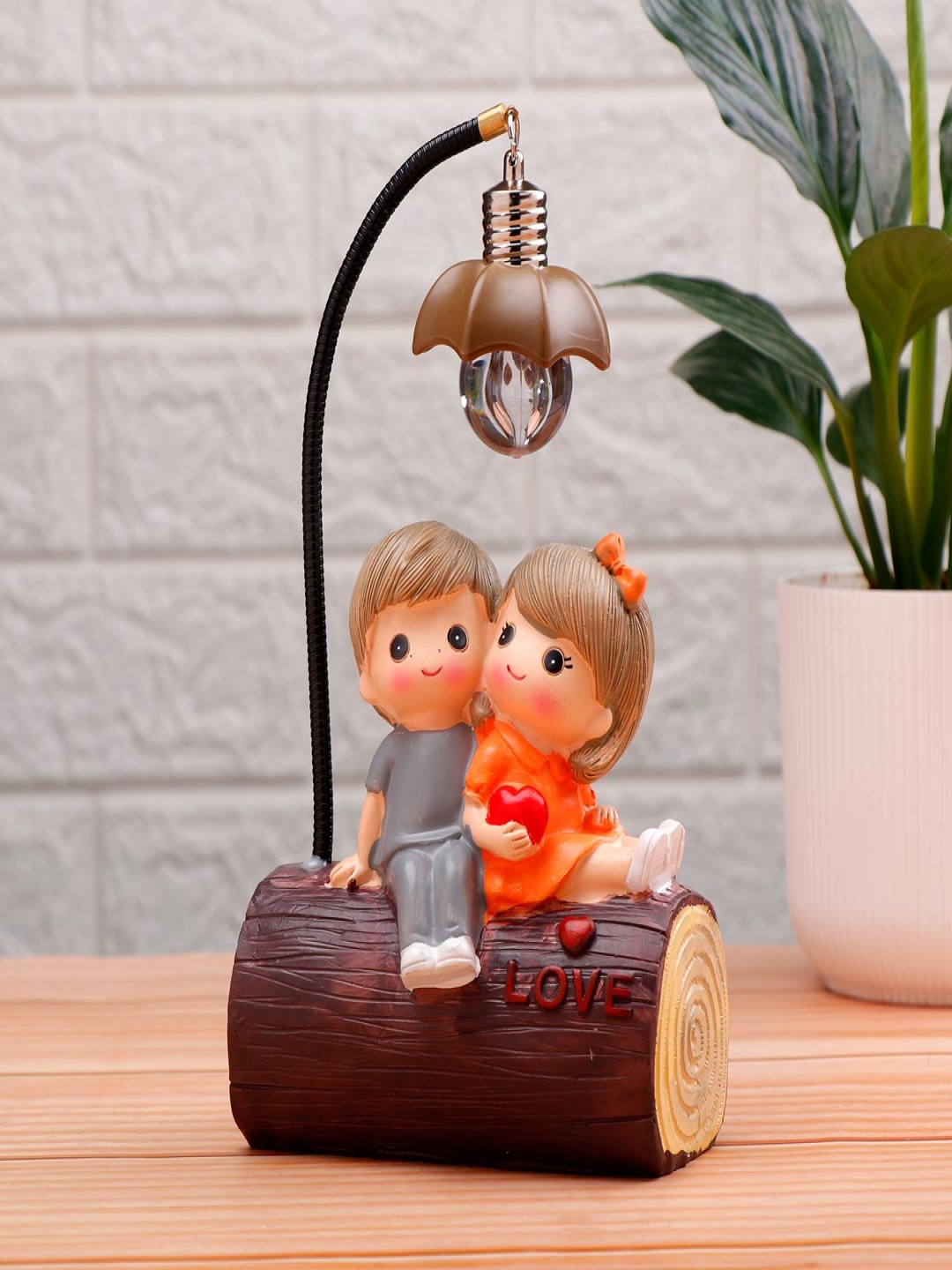 

Archies Grey and Orange Cute Couple Figurine Showpiece