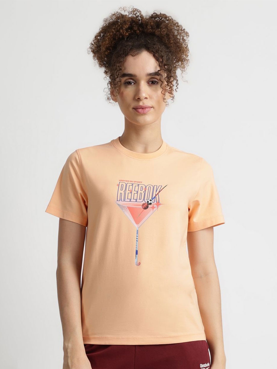 

Reebok Women Graphic Printed Short Sleeves Cotton Casual T-shirt, Peach