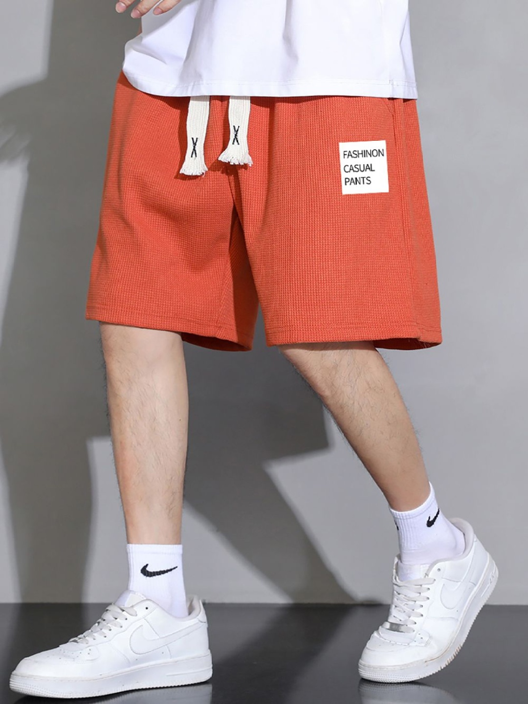 

StyleCast x Revolte Men Printed Mid-Rise Shorts, Orange