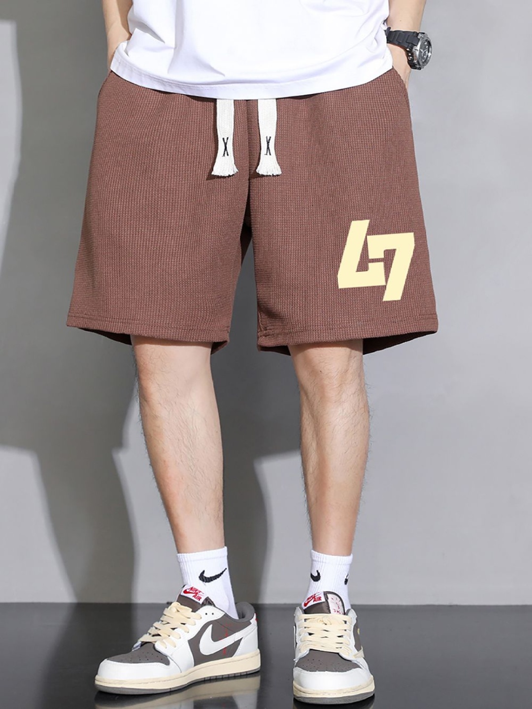 

StyleCast x Revolte Men Typography Printed Shorts, Coffee brown