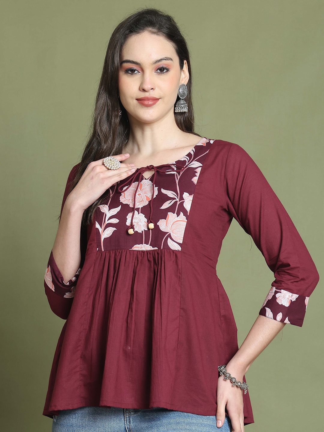 

Rajnandini Women Floral Printed Tie-Up Neck Cotton A-Line Top, Maroon