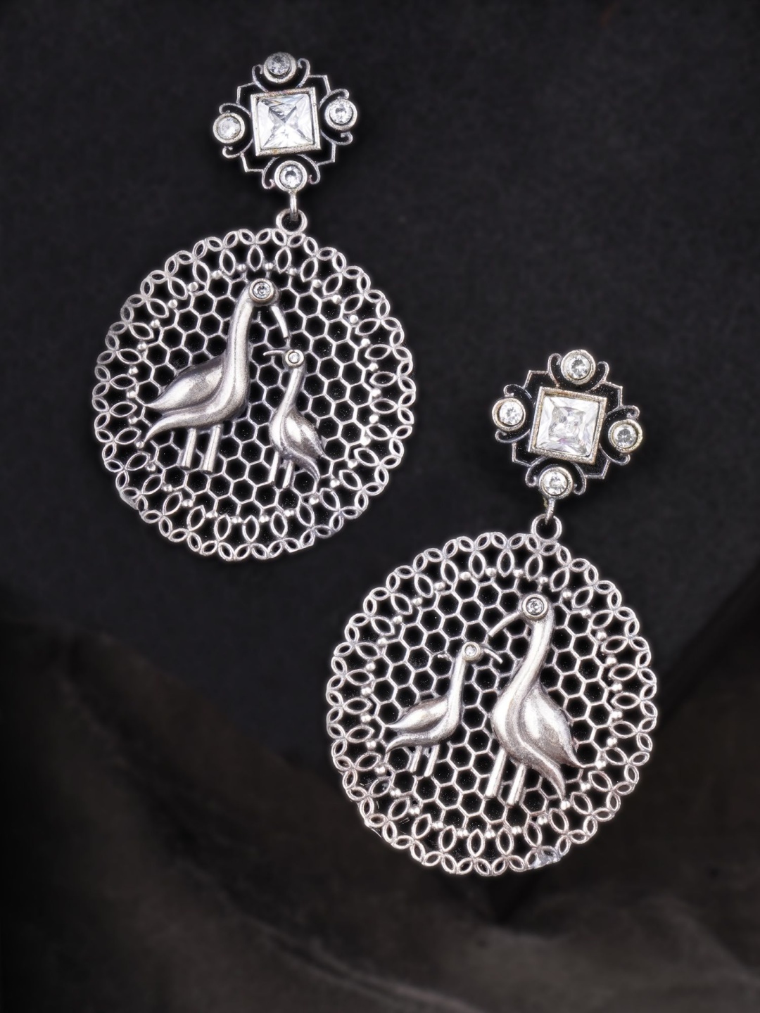 

Adwitiya Silver-Plated Artificial Stones Studded Circular Shaped Drop Earrings