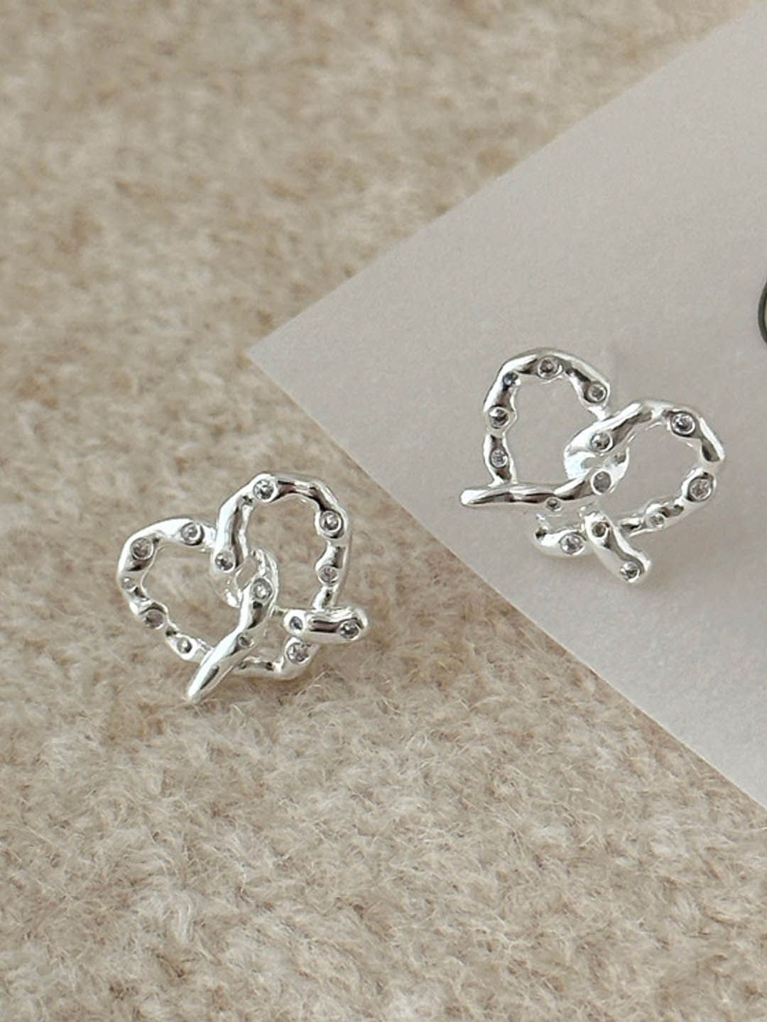 

StyleCast Elegant Silver Artificial Stones Studded Heart Shaped Studs