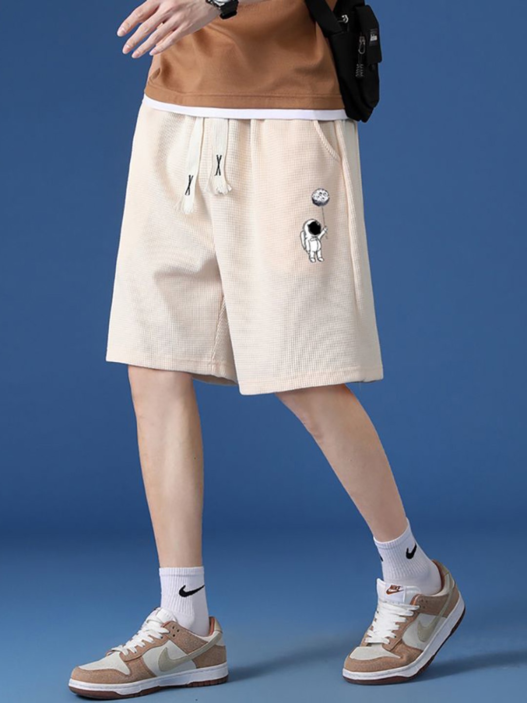 

StyleCast x Revolte Men Printed Shorts, Beige