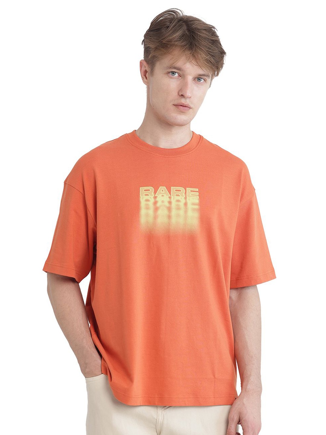 

RARE RABBIT Men Typography Printed Round Neck Cotton Oversized T-shirt, Rust