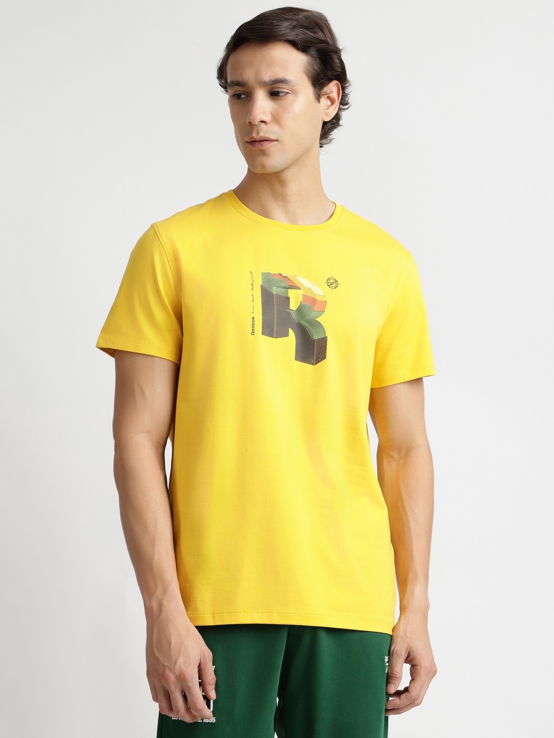 

Reebok Men Typography Printed Short Sleeves Cotton Casual T-shirt, Yellow