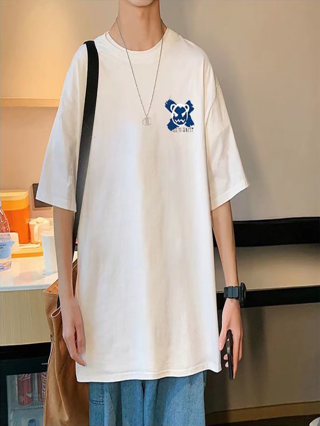 

StyleCast x Revolte Men Graphic Printed Round Neck Oversized T-shirt, White