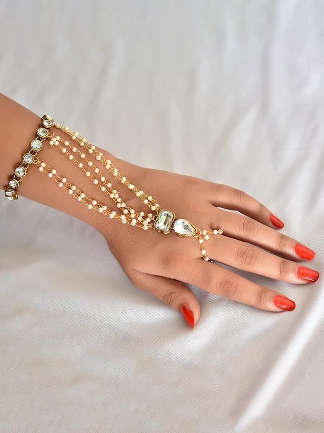 

Kezlin Gold-Plated Kundan Studded Adjustable Haath Phool Bracelet