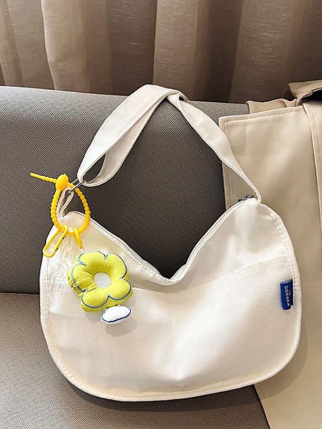

StyleCast Half Moon Sling Bag with Applique, Cream