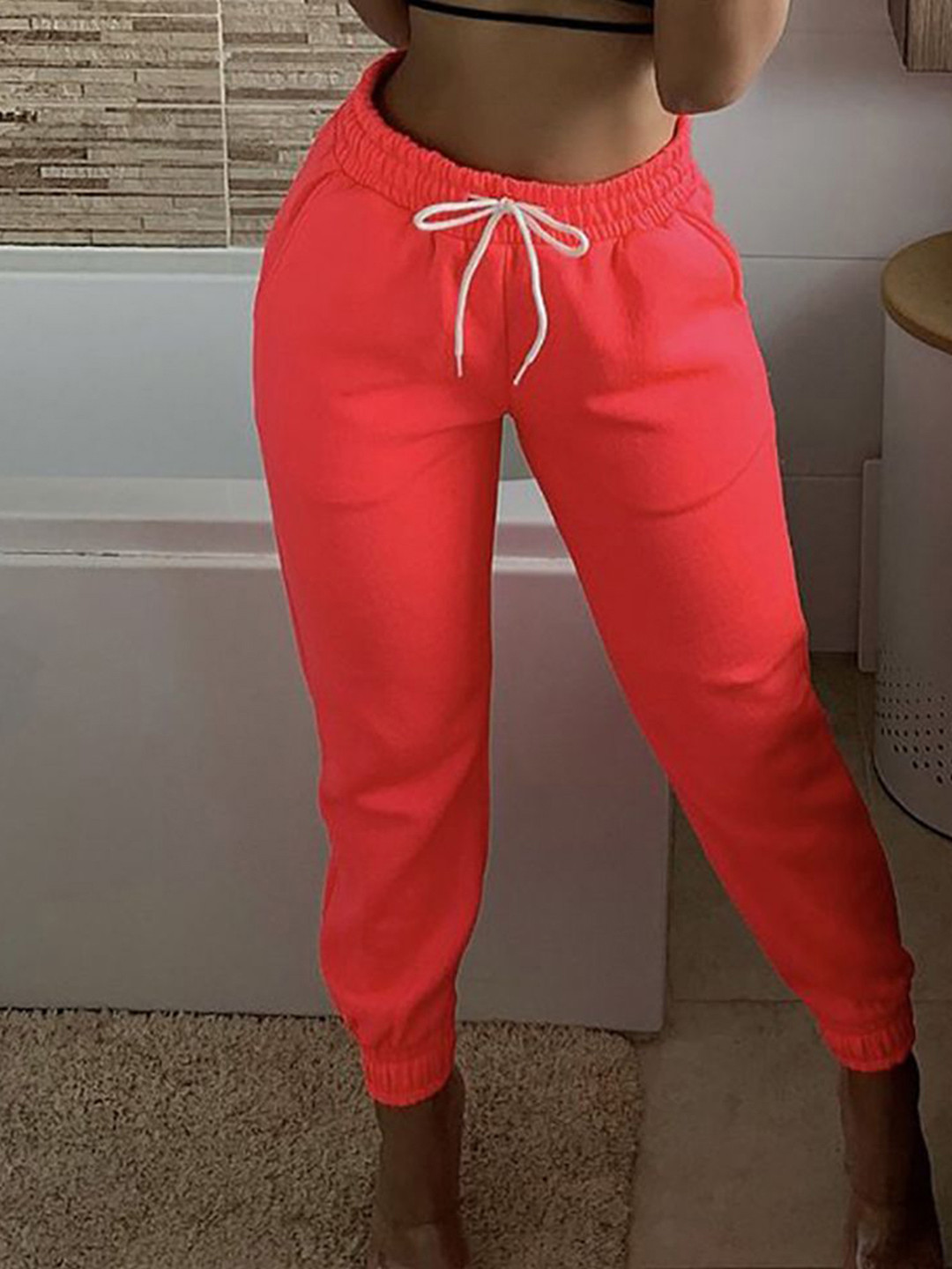 

StyleCast x Revolte Women Regular Fit Easy Wash Joggers Trousers, Orange