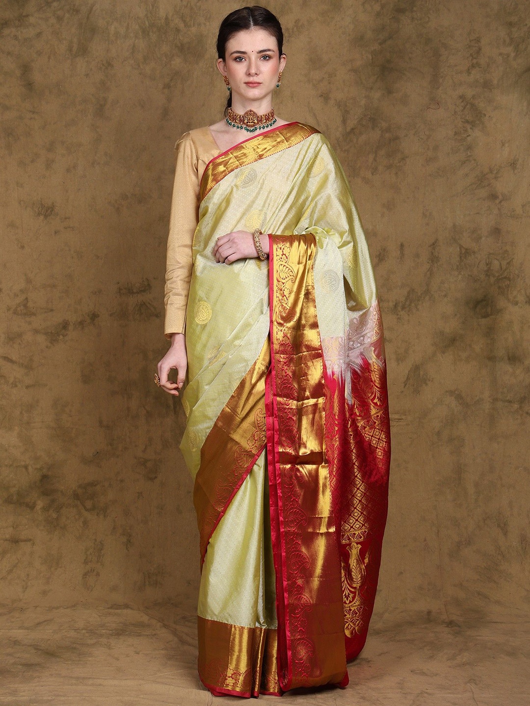 

Exotic India Pure Silk Saree with Paisley Motifs and Intricate Golden Thread work, Off white