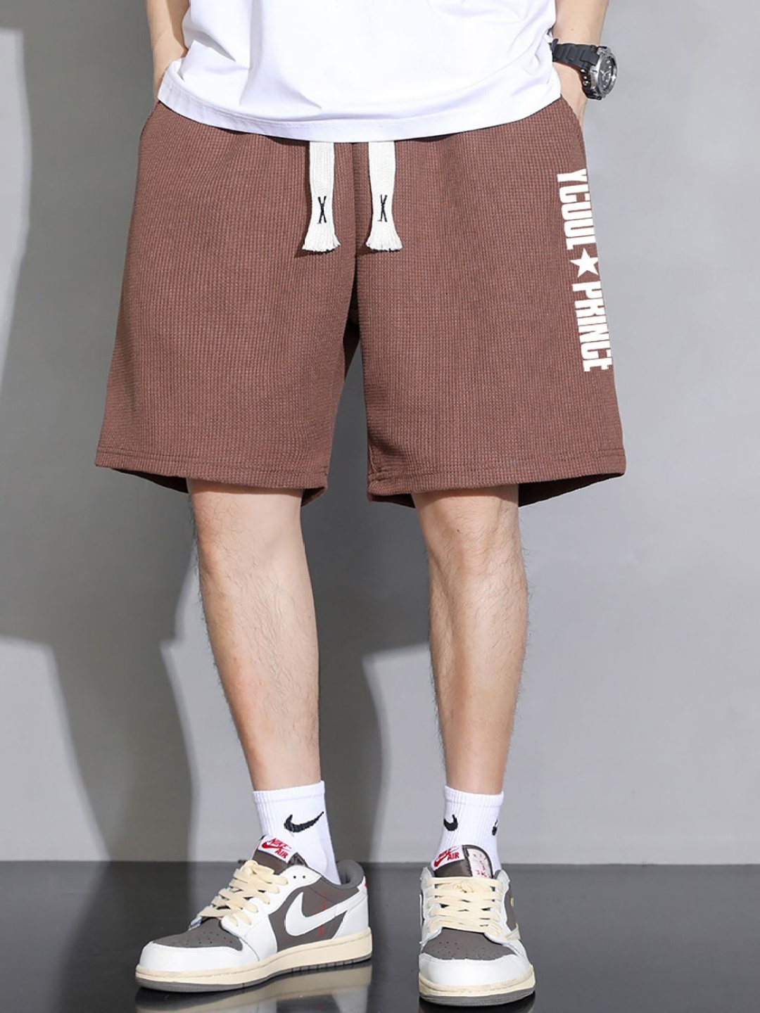

StyleCast x Revolte Men Typography Printed Regular Shorts, Coffee brown