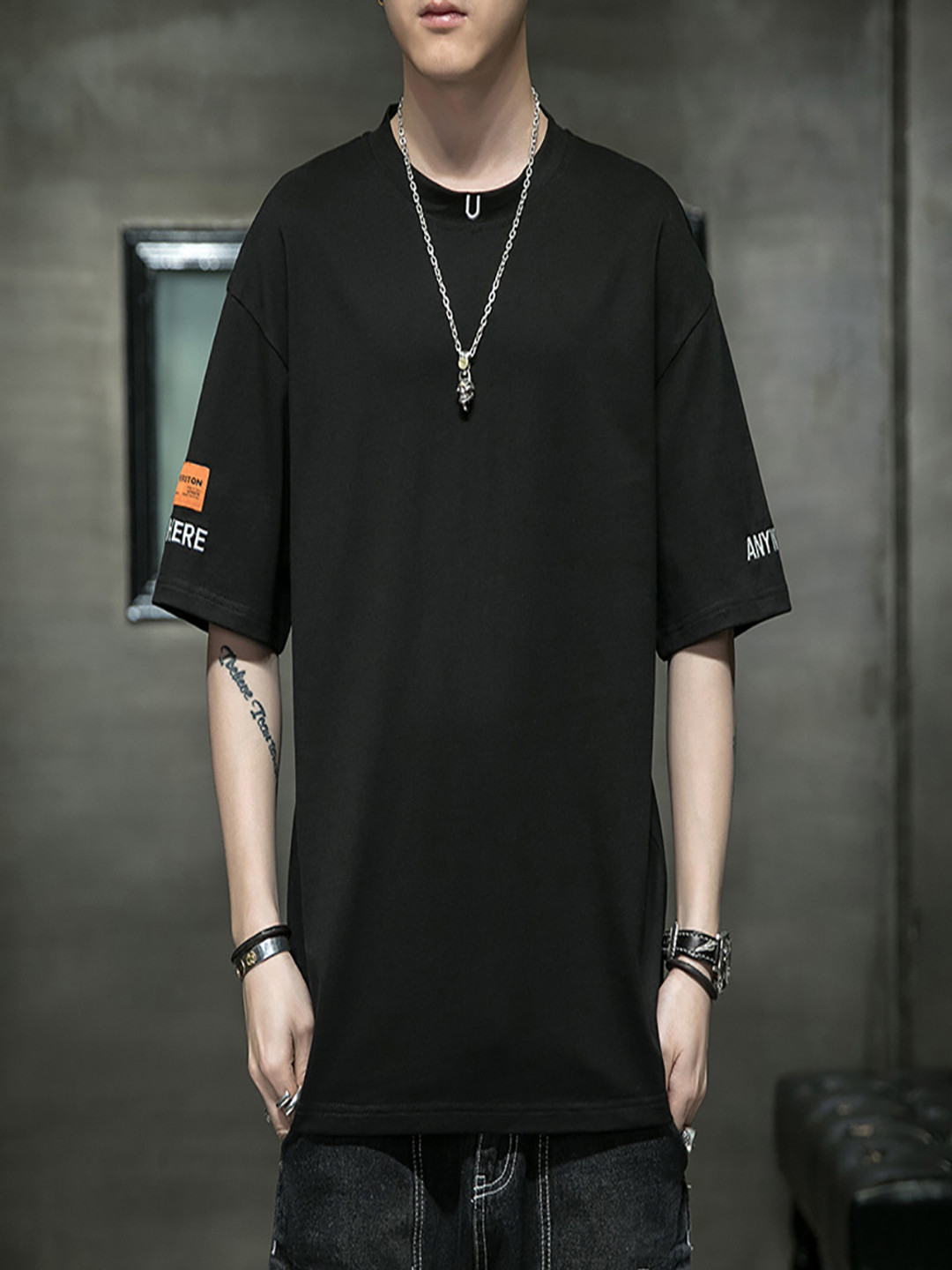 

StyleCast x Revolte Men Solid Round Neck Oversized T-shirt, Black