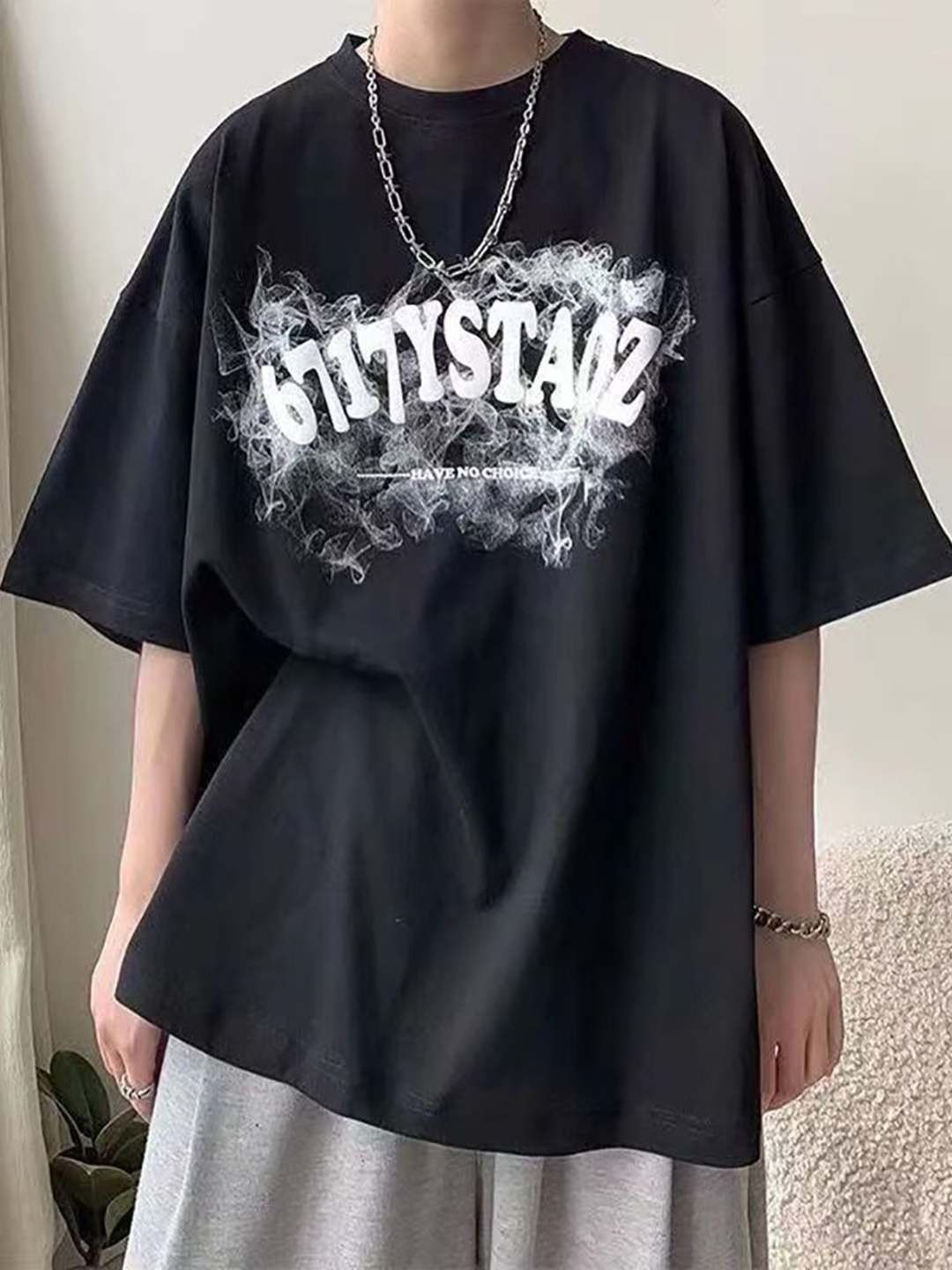 

StyleCast x Revolte Men Typography Printed Round Neck Oversized T-shirt, Black