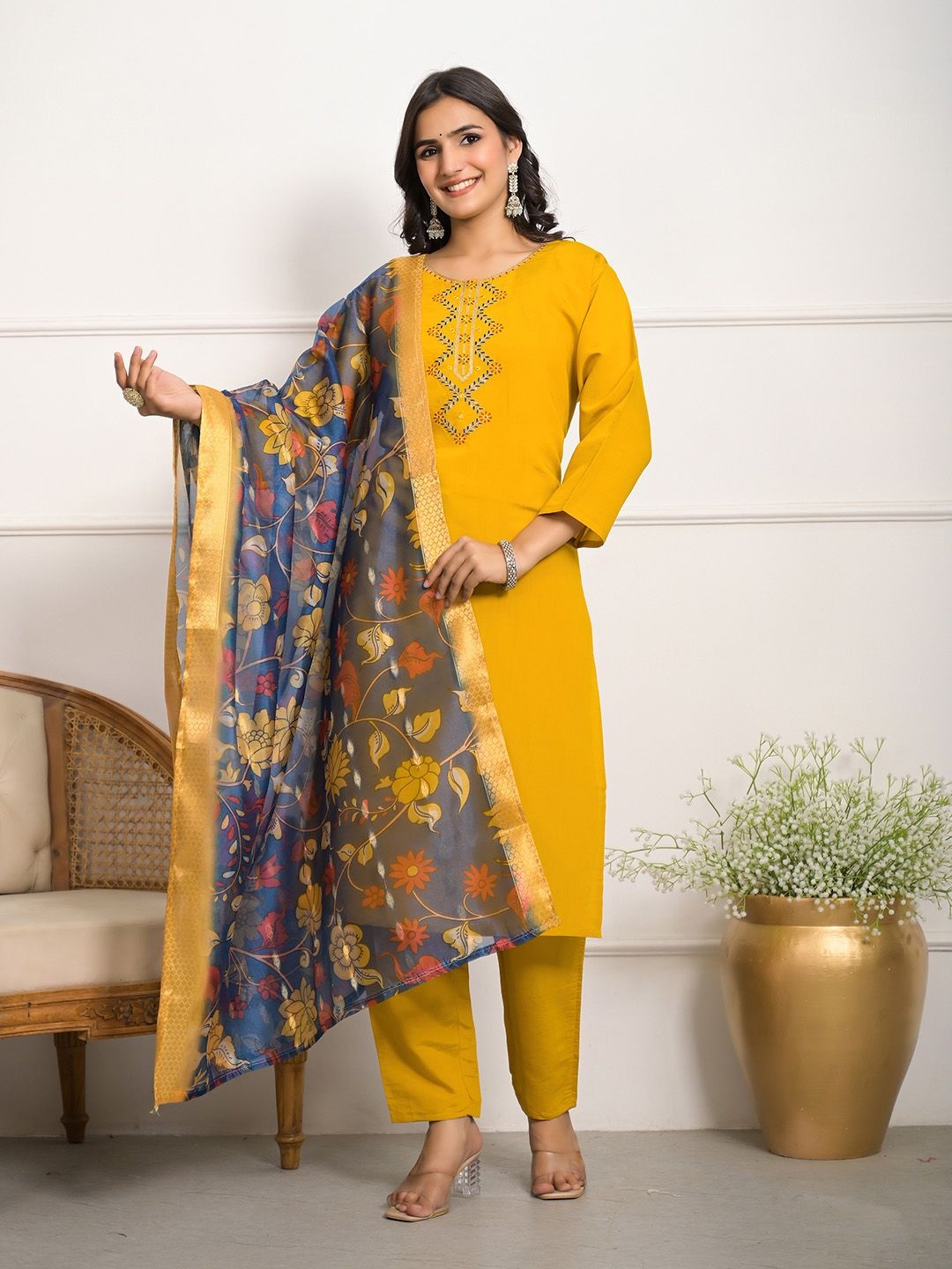 

Meena Bazaar Floral Yoke Design Thread Work Straight Kurta With Trouser And Dupatta, Mustard