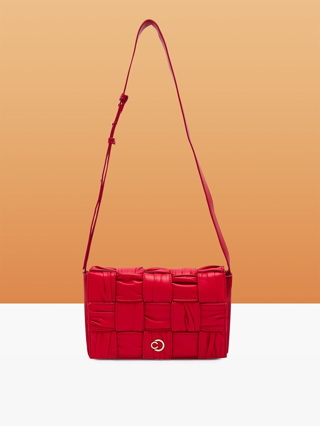 

Caprese Women Solid Structured Leather Sling Bag, Red